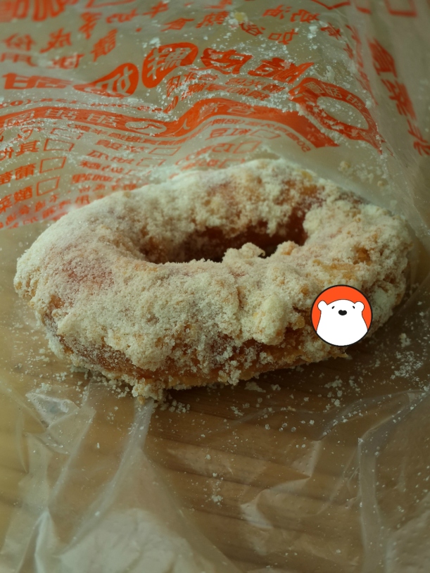 The very yummy deep-fried donut with crusty sugar. 