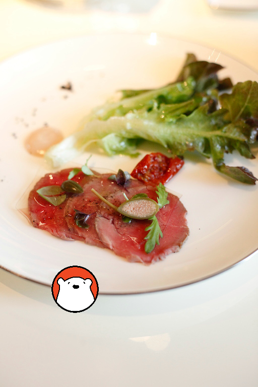 A choice of appetiser - veal carpaccio with tuna dressing, sun-dried tomato and oak leaf lettuce. 