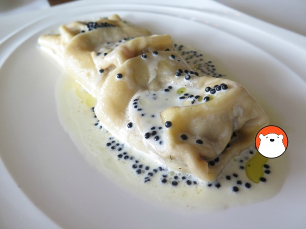 King Prawn Ravioli 520 Filled with smoked eggplants puree and King Prawn meat, tossed with Italian butter and thyme, served with avruga caviar cream. 