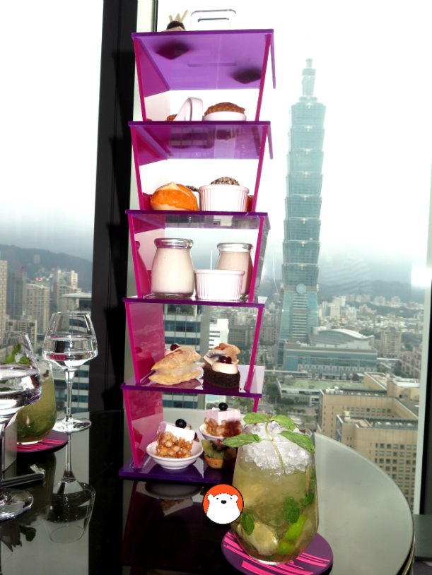 A set of afternoon tea at Yen Bar overlooking this view of Taipei 101.