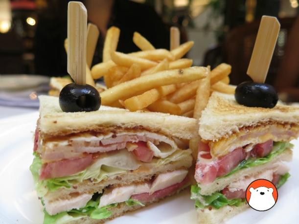Club Sandwich (Bt270++) with slow-cooked chicken breast, smoked turkey bacon and fried egg. Served with either french fries or salad. 